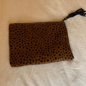 Gently used leopard pony hair clutch